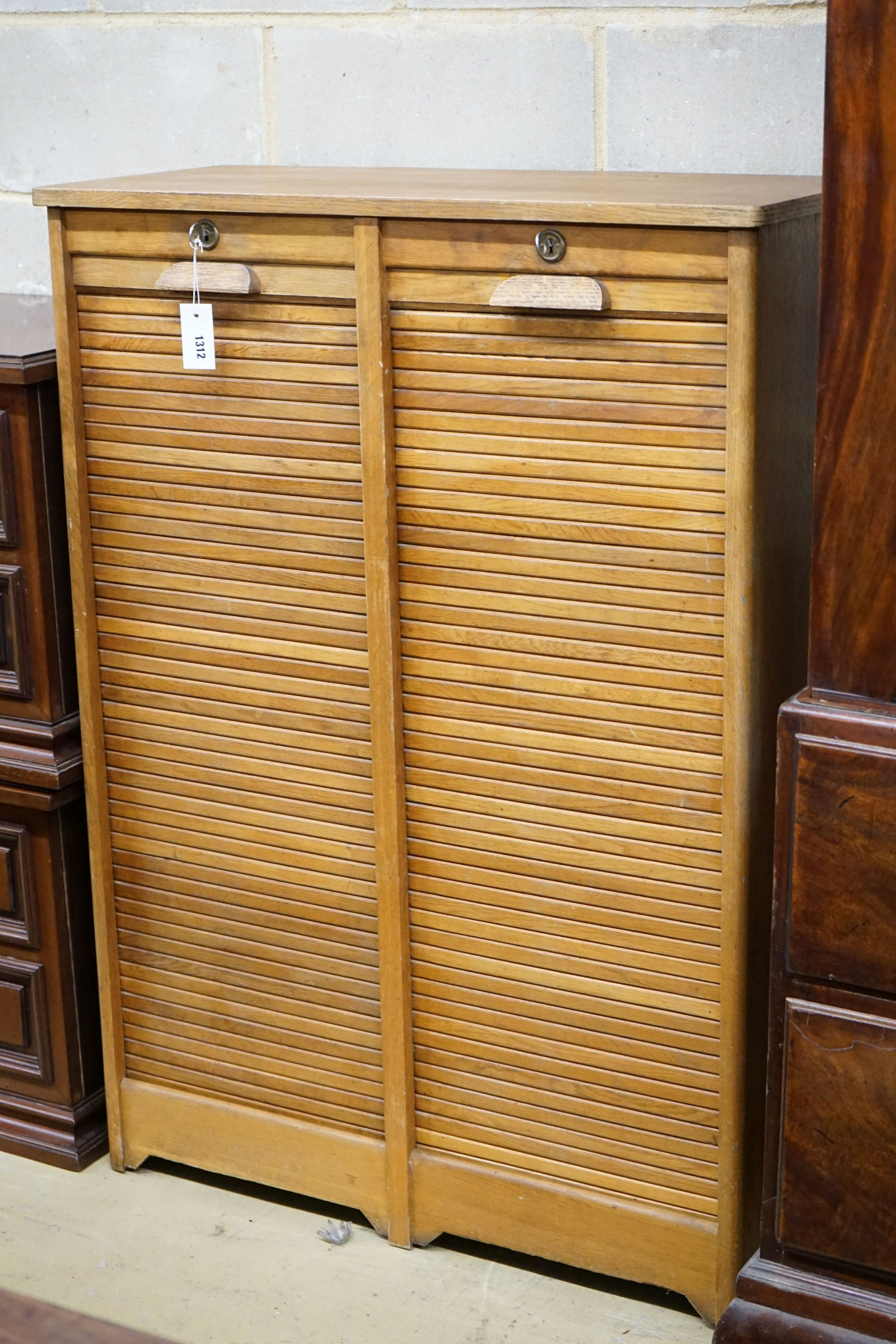 A mid 20th century oak tambour double filing cabinet, width 86cm, depth 38cm, height 120cm